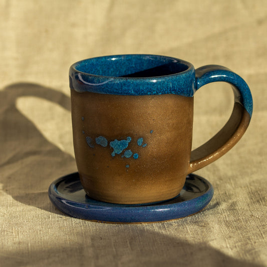 Ceramic cup with saucer